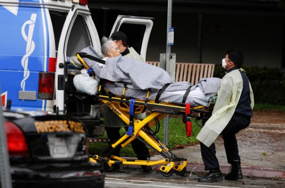 A patient is evacuated from the Magnolia Rehabilitation and Nursing Center in Riverside, California.